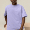 mockup of a serious man wearing an oversized tee and a dad hat at a studio m26647