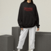 mockup of a woman wearing a hoodie with customizable sleeves at a studio m26166