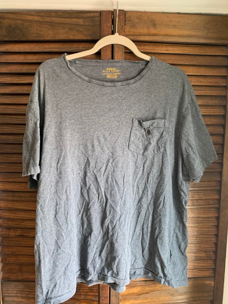 Low GSM t shirt with stretched collar and curled hem after washing